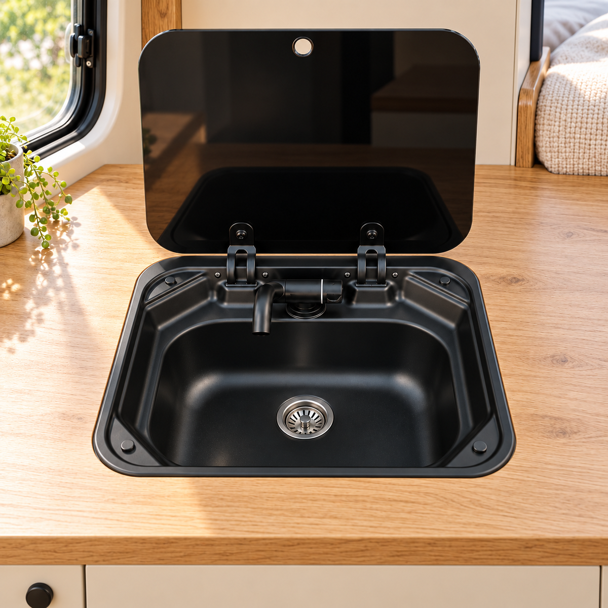 40 × 35 cm black sink installed in a campervan — illustration