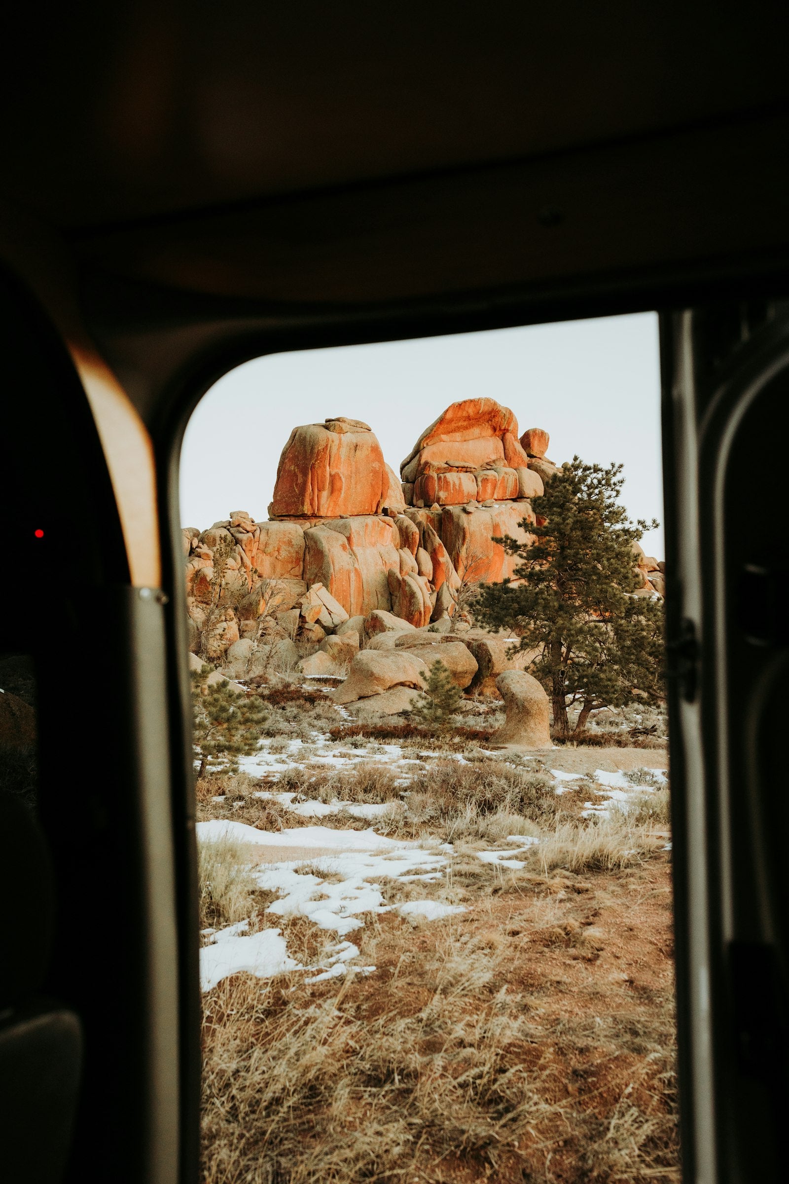 View from inside a van onto a rocky landscape